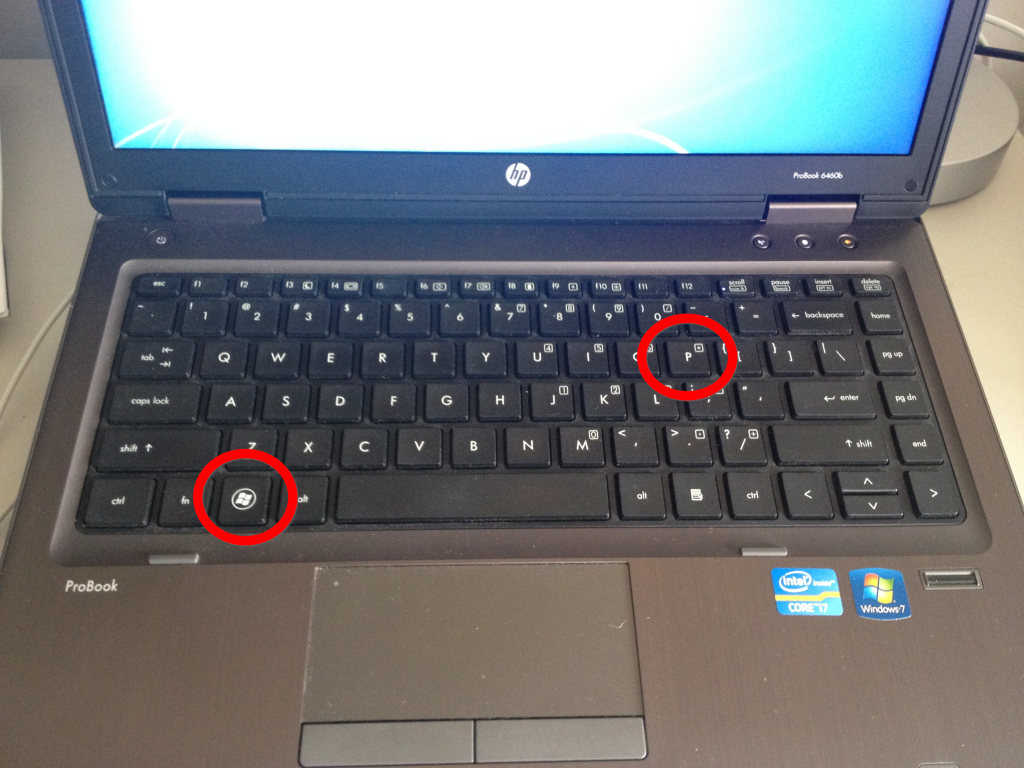 Picture shows both the Windows and P keys highlighted.
